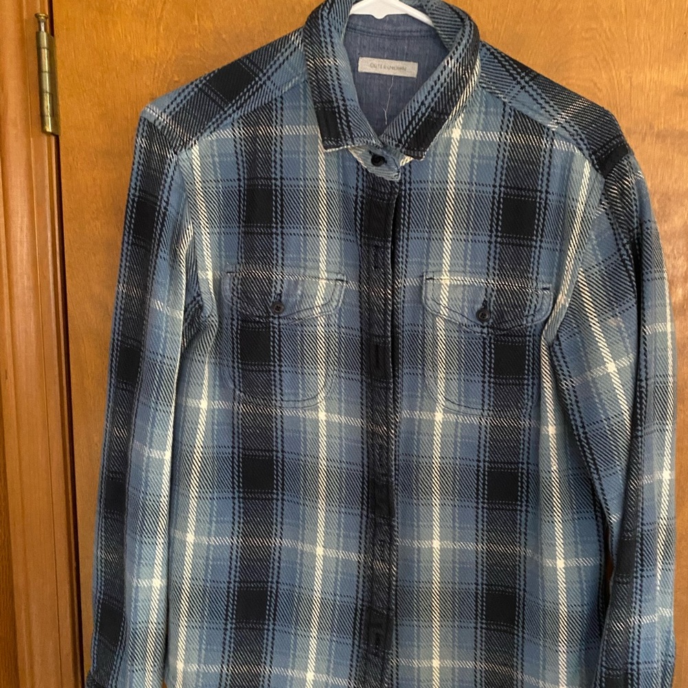 Out or known flannel over shirt